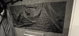 A Paha Que Custom Black Out Curtain, made from privacy blackout material, is attached to a gray carpeted wall above a silver metal plate engraved with inTech.