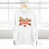 The PahaQue Unisex Premium Pullover Hoodie in white by Printify hangs on a hanger, featuring a wilderness logo with a tent graphic and Est. 1997 in red and orange tones. Its cozy fleece lining is ideal for chilly days.