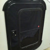 A close-up of a black rectangular camper door with a rounded frame and dark window, set in a light wall—ideal for use with the Paha Que Custom Mounting Kit for Trailer Side Tents 10x10 and 5x7.