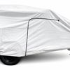 A Hiker Trailer is shielded by a Paha Que Custom Hiker Trailer Covers Custom Fit Outdoor Protection, featuring one visible wheel and a hitch with a small front support wheel.