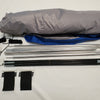 A disassembled Paha Que Custom R Pod Trailer Visor kit on a white surface, showing rolled fabric, metal poles, straps, and cords—perfect for anyone seeking premium R Pod accessories.