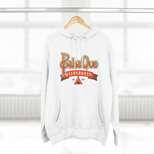 The PahaQue Unisex Premium Pullover Hoodie in white by Printify hangs on a hanger, featuring a wilderness logo with a tent graphic and Est. 1997 in red and orange tones. Its cozy fleece lining is ideal for chilly days.