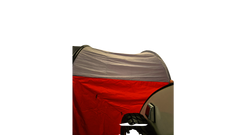 A NuCamp TAB 360 Trailer Awning by Paha Que Custom acts as a waterproof shelter, set up at night and attached to a vehicle with a spare tire and side mirror visible in the darkness.