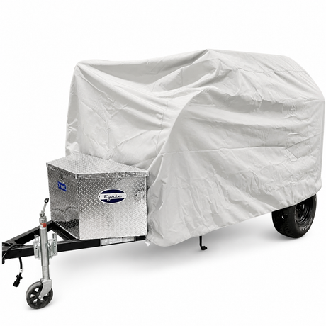 The PahaQue Wilderness Aero Teardrops Trailer Cover in gray offers top protection for small trailers with front metal toolboxes, shielding the trailer while leaving its wheels and hitch partially visible.