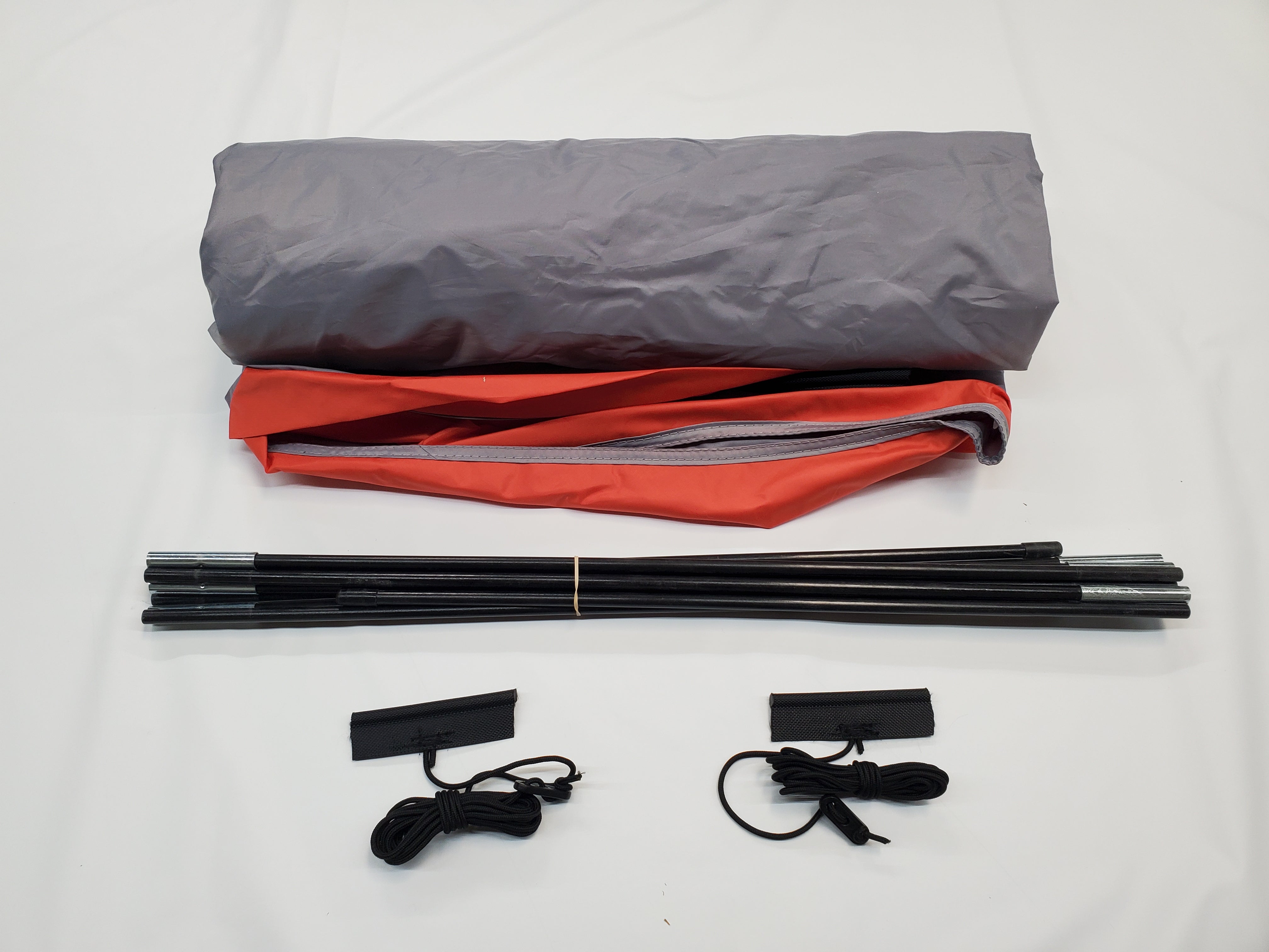 The Paha Que Custom Ultimate Toys Trailer Visor Camping Accessory for Ultimate Toys Camper includes a gray tent body, red rainfly, black poles, and two sets of black cords with stakes—perfect for your trailer awning or camper visor setup.