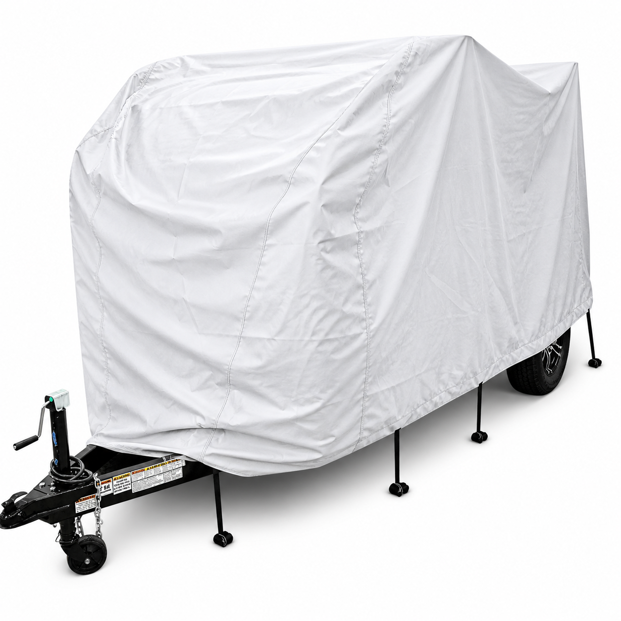 A small trailer is protected with the Ultimate Toys Trailer Cover by PahaQue, featuring durable weather-resistant material by Paha Que Custom, standing on four stabilizing jacks with a black hitch and jack visible at the front.