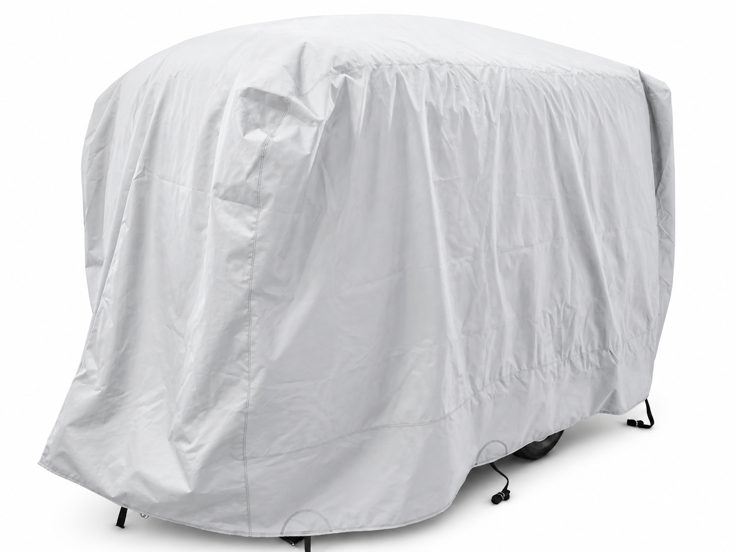 A large vehicle is fully covered with the Paha Que Custom Happier Camper HC1 Cover, a light gray custom-fit trailer cover that offers weather protection. Only the outline and part of the wheels are visible underneath.