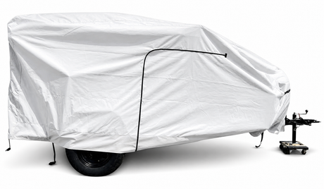 A Hiker Trailer is shielded by a Paha Que Custom Hiker Trailer Covers Custom Fit Outdoor Protection, featuring one visible wheel and a hitch with a small front support wheel.