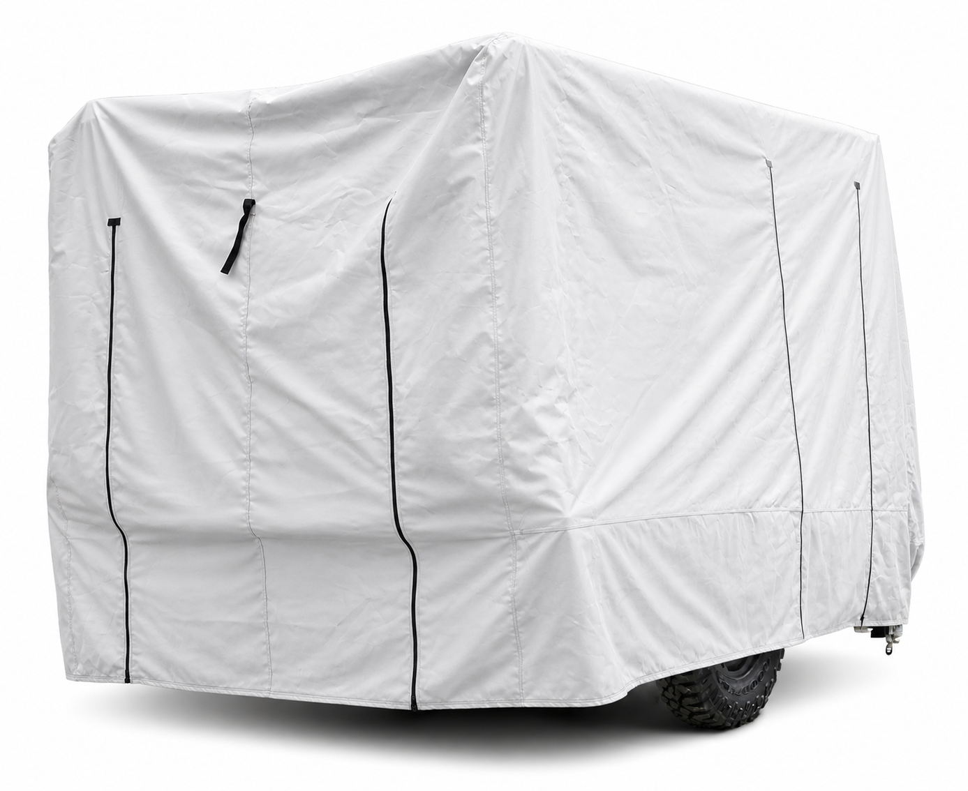 A large vehicle, likely an RV or trailer, is fully enclosed in a Paha Que Custom Hiker Trailer Covers Custom Fit Outdoor Protection. Black zippers and seams are visible, with part of a black tire peeking out from beneath the cover.