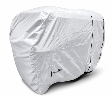 A Meerkat Trailer Cover Heavy Duty MagnaTuff Fabric by Paha Que Custom, featuring the Meerkat logo, fits snugly over a compact trailer or small camper with black drawstrings; only the wheels are partly visible at the bottom.