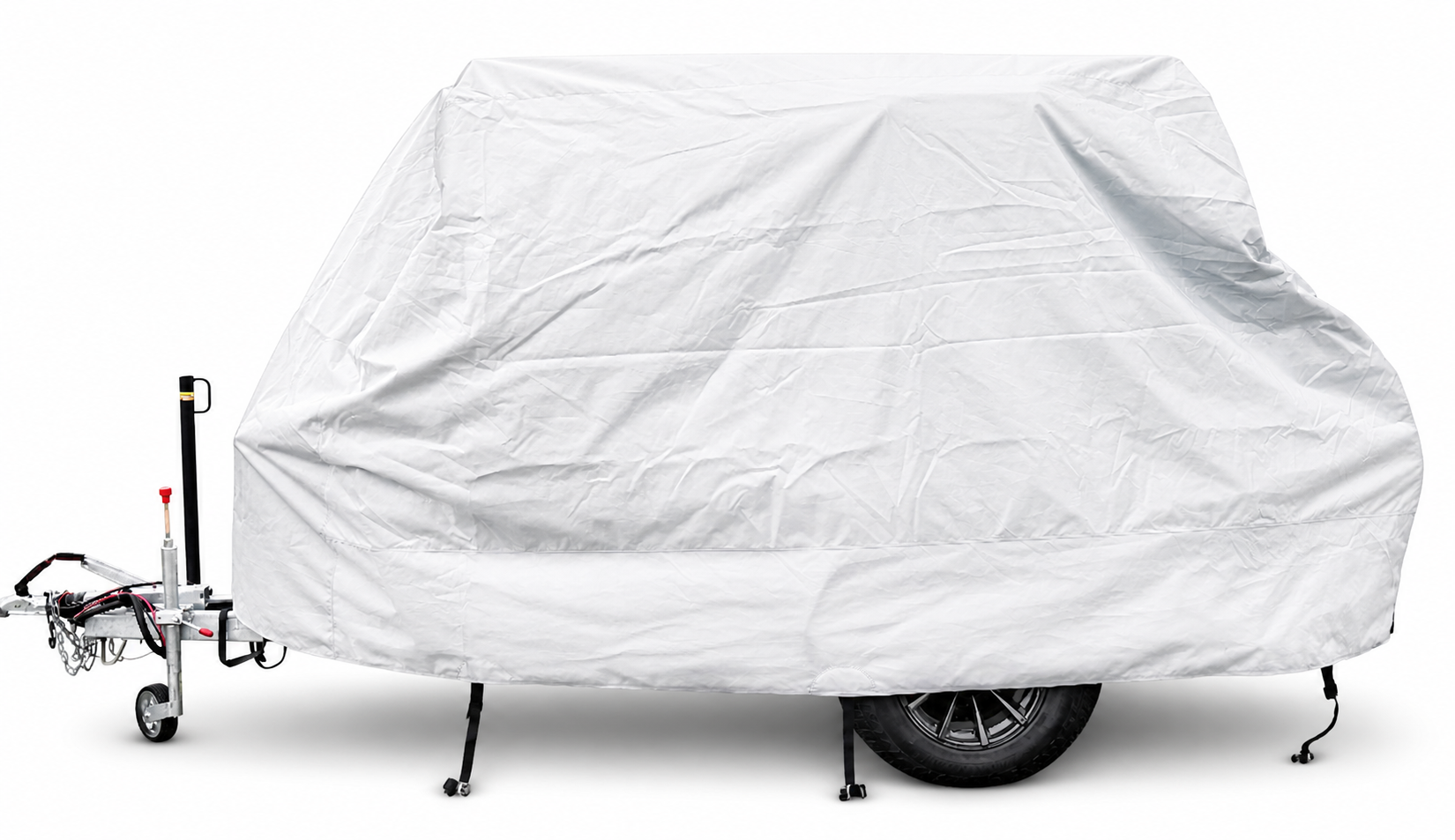 A 6x13 Squaredrop Trailer is protected by the Paha Que Custom Squaredrop Trailer Cover made of heavy-duty MagnaTuff fabric in white, concealing its shape while leaving the wheel, hitch, and support legs visible for easy access.