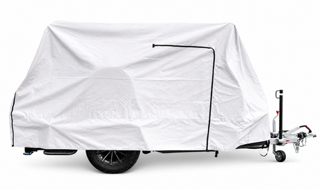 The Paha Que Custom Squaredrop Trailer Cover 6 x 13 features heavy duty MagnaTuff fabric, a white weatherproof tarp, black zippers, and visible tow hitch and wheels, all displayed against a plain white background.