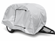 The Paha Que Custom Teardrop Trailer Cover, 4' wide and made from heavy duty MagnaTuff fabric, is light gray with a zippered side opening for easy access and provides weather protection for small utility trailers.