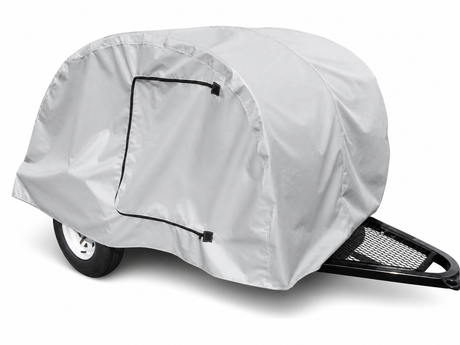 The Paha Que Custom Teardrop Trailer Cover, 4' wide and made from heavy duty MagnaTuff fabric, is light gray with a zippered side opening for easy access and provides weather protection for small utility trailers.