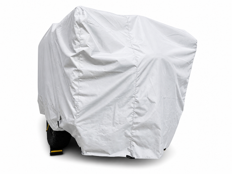 A Teton X Trailer, mostly concealed by a white Paha Que Custom Teton X Trailer Cover Premium Protection, shows just part of a black tire and yellow wheel chock at the bottom against a plain white background.