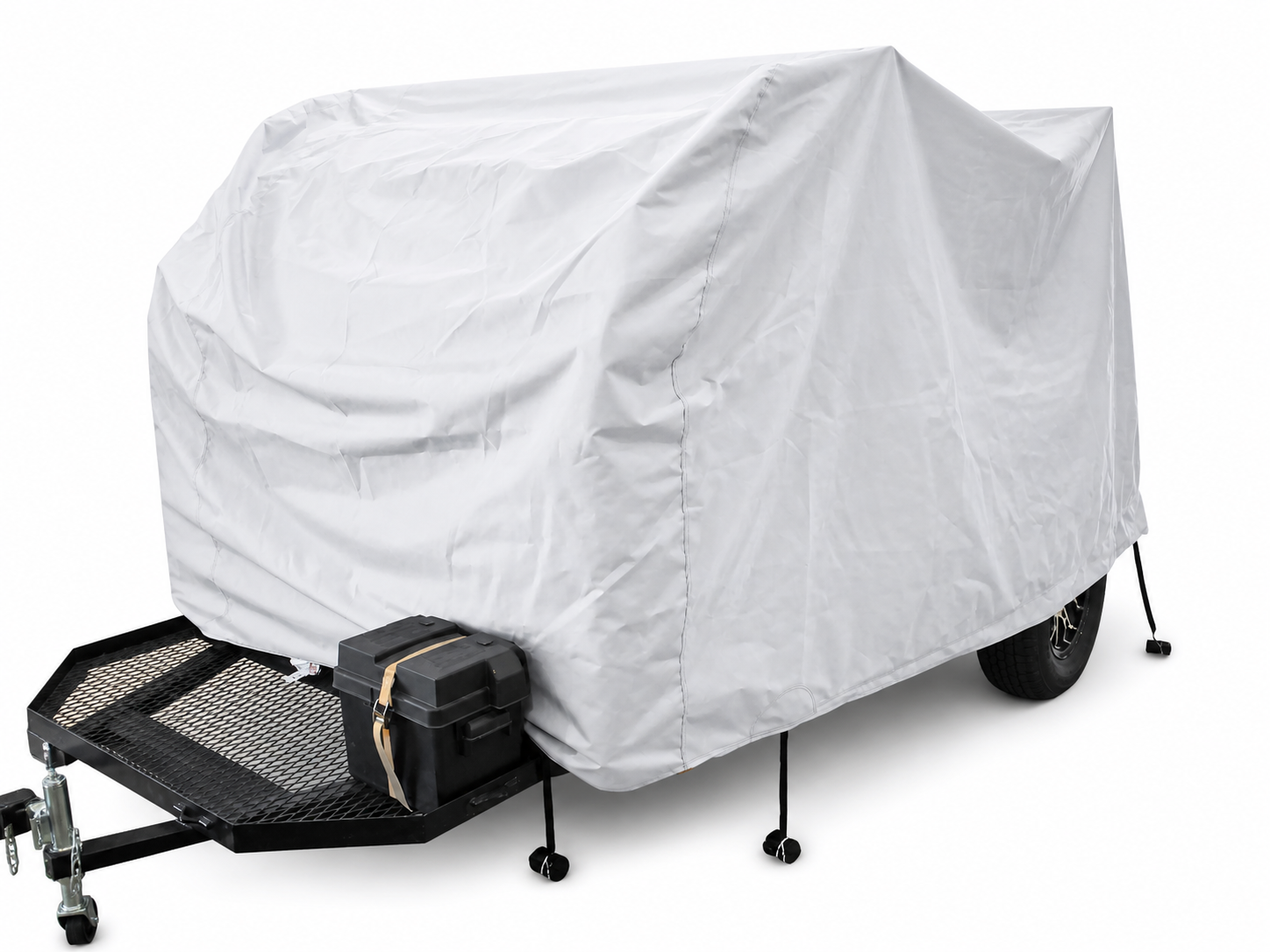 A UKAN Camp 590G/585G 5x9 utility trailer by PahaQue Wilderness features a white custom-fit cover for protection, black metal frame, front storage box, and four stabilizing legs, parked on a flat surface.
