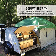 A small teardrop camper with its side hatch open shows a compact outdoor kitchen. Next to it is a Paha Que Custom 10x10 Side Mount Screen Room Tent by PahaQue for Camping and Outdoor Adventures, compatible with select trailer models.