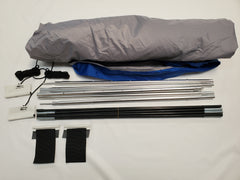 A disassembled Paha Que Custom R Pod Trailer Visor kit on a white surface, showing rolled fabric, metal poles, straps, and cords—perfect for anyone seeking premium R Pod accessories.