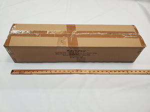 A sealed rectangular cardboard box labeled Paha Que Custom R Pod Trailer Visor sits on a white surface behind a 36-inch wooden ruler, with printed text on the side showing it as one of the latest R-Pod accessories.