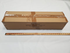 A sealed rectangular cardboard box labeled Paha Que Custom R Pod Trailer Visor sits on a white surface behind a 36-inch wooden ruler, with printed text on the side showing it as one of the latest R-Pod accessories.
