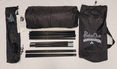Paha Que Custom 5x7 Trailer Side Tent Screen Room kit shown on a white surface with two black carry bags, folded tent fabric, instructions, stakes, and tent poles—perfect for camping or as a trailer side tent. PahaQue Wilderness logo visible.